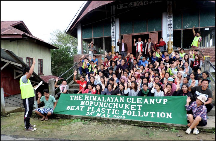 Volunteers being administered the pledge to be ambassadors of plastic-free village during the Himalayan Cleanup at Mopungchuket village on May 25. (Morung Photo)
